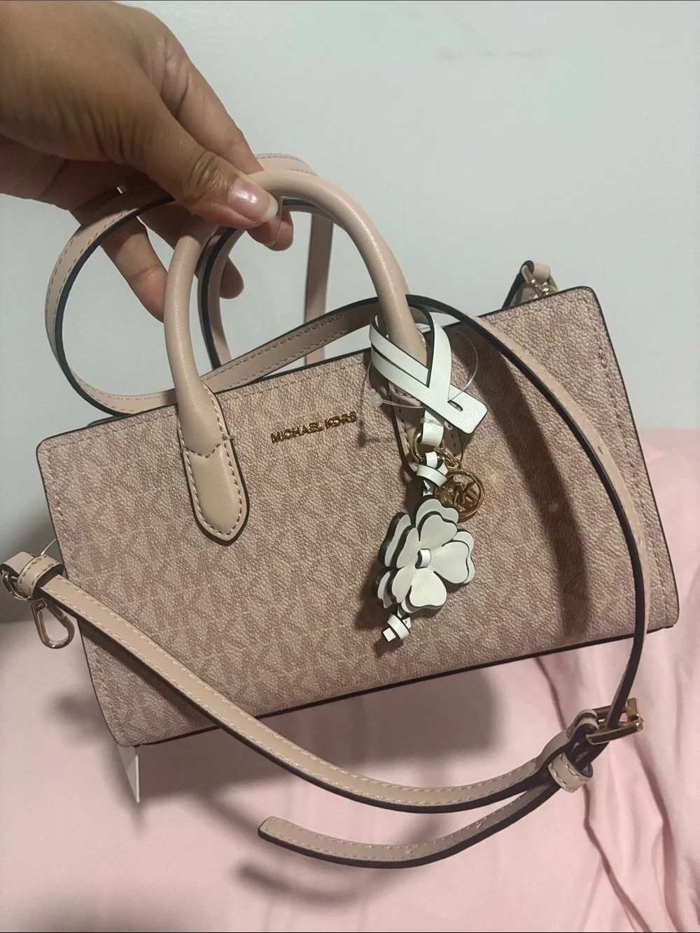A cute MICHAEL KORS Blush Pink Logo Satchel with Floral Charm